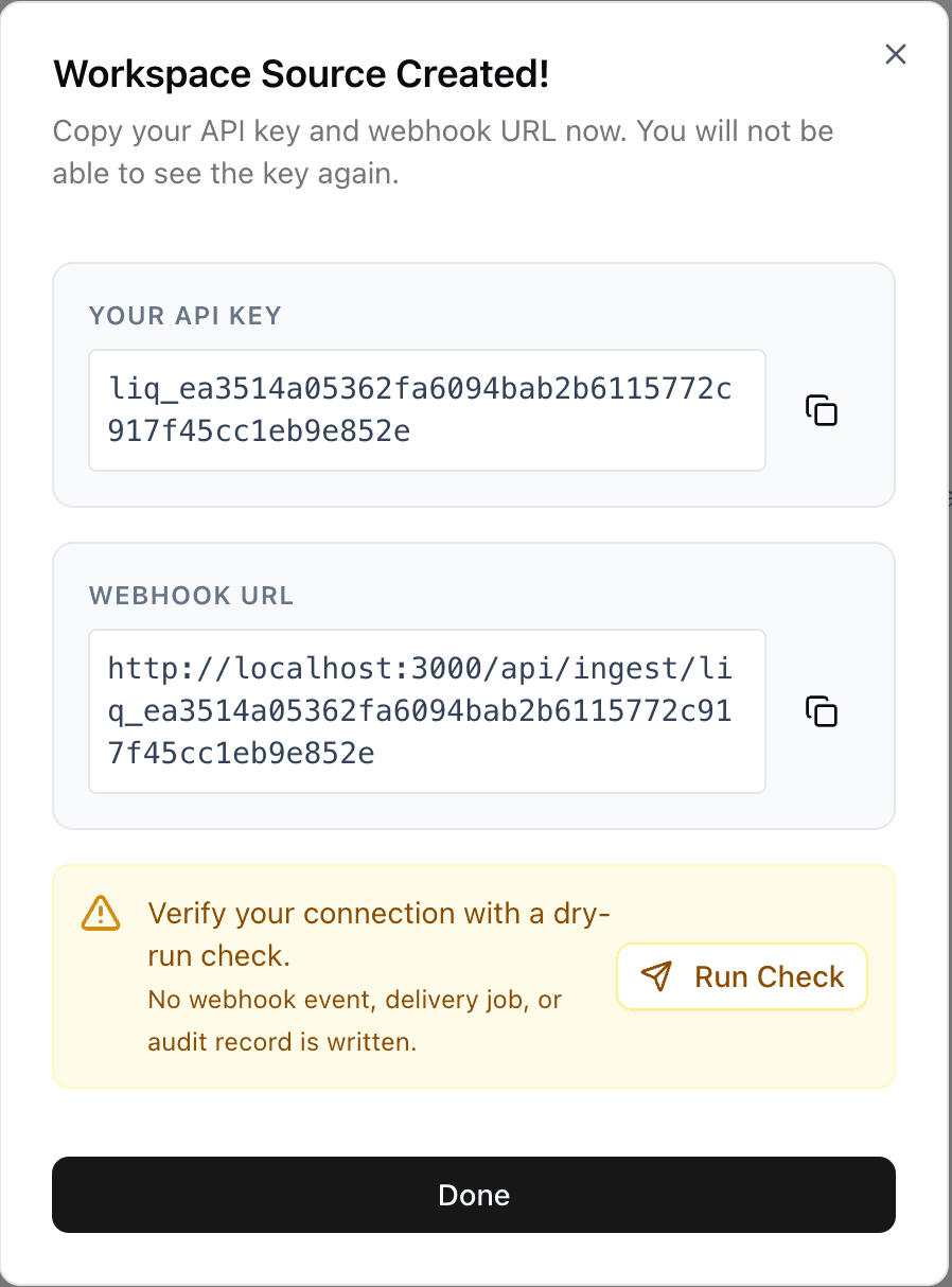 Workspace Source Created modal showing API key and webhook URL